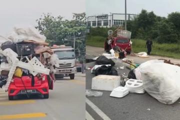 马国男子用小型车搬家  满车家当半路散满地